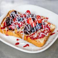Very Berry French Toast · French toast topped fresh strawberries, blackberries, blueberries, raspberries, and powdered...