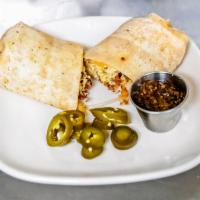 Breakfast Burrito · Scrambled eggs, aged cheddar, your choice of sausage, and bacon or chorizo all rolled up in ...