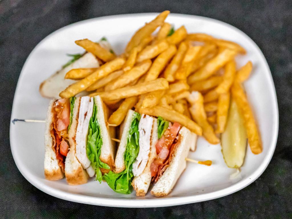 Turkey Bacon Club Sandwiche · Triple decker! House roasted turkey breast, crispy applewood smoked bacon, lettuce and tomato with mayo on toasted sourdough 
