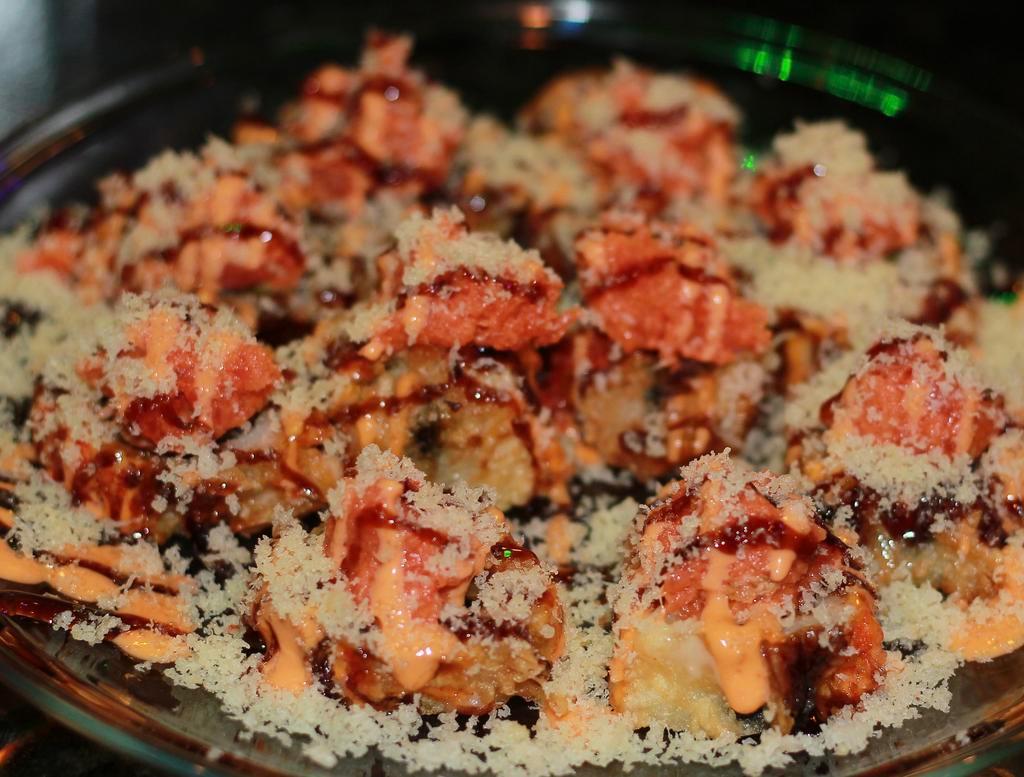 Crazy Roll · Deep fried spicy crabmeat, asparagus with spicy tuna and crunch on top. Hot and spicy.