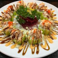Rockin Roll · Tempura shrimp, cucumber, avocado wrapped in soy paper with blue crab salad, crunch, massage...