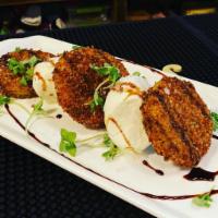 Fried Green Tomato & Burrata Salad  · vegetarian. With a Balsamic Reduction