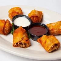 Reuben Egg Rolls · Our famous reuben sandwich wrapped up in a wonton and fried to golden deliciousness. Served ...