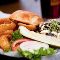 Tuscan Chicken Sandwich · Juicy grilled chicken breast topped with mozzarella cheese, basil, roasted red peppers and d...