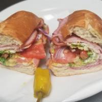 Ham and Cheese Sandwich · Mayo, mustard, tomatoes, onions and lettuce. Served on 12