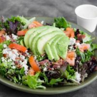 House Salad · Our house salad starts with fresh mixed greens, and is topped with tomatoes, cucumbers, mush...