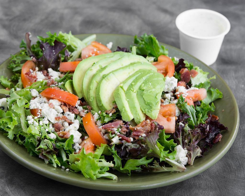 House Salad · Our House Salad is made with spring mix lettuce, tomato, cucumber, mushrooms, and mixed grated cheese.  Avocado, and other toppings can be added for an additional charge.