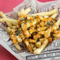 Umami Fries · Crispy fries tossed in our garlic butter, and topped with furikake and a Sriracha aioli. The...