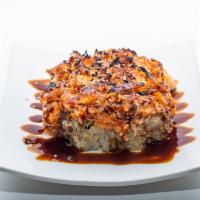 Volcano Roll · Baked. Crabmeat, avocado and cucumber topped with scallop, crabmeat, masago, and onion with ...