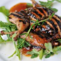 Quail · Grilled quail marinated in saffron, olive oil and spices.