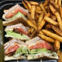 Club Sandwich Lunch · Includes garnish and choice of side.