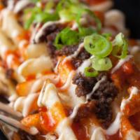 Kamikaze Fries · Freshly fried potato wafer fries, minced Korean BBQ beef, kimchi, Japanese mayo, red sauce, ...