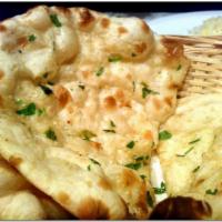 72. Garlic Naan · Naan stuffed with fresh garlic.