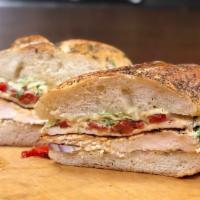 Chicken and Brie · Grilled chicken filets, roasted peppers, shaved red onions, arugula, spicy mayo and Brie che...