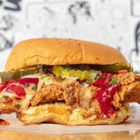 TRUFFLE HOT HONEY CHICKEN SANDWICH · crispy chicken, red pepper jam, white BBQ, truffle hot honey, kosher pickles, served with fr...