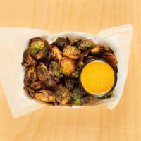CRISPY BRUSSELS SPROUTS · with sesame-tahini