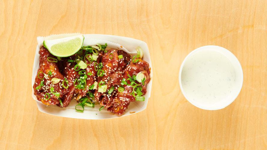 KOREAN BBQ WINGS · 6 piece | sweet & spicy BBQ, scallion, sesame seeds, lime, served with house buttermilk-dill