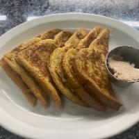 French Toast · Thick slices of Texas toast smothered in our own batter and grilled to perfection.