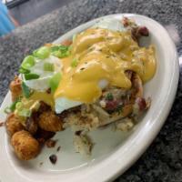 Jake's Benedict · English muffin topped with homemade hash, poached eggs, and cheddar cheese sauce.