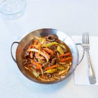 8. Spicy Beef  · Stir fried beef with onions, celery and carrots in spicy sauce. Serve with steamed rice. Spi...