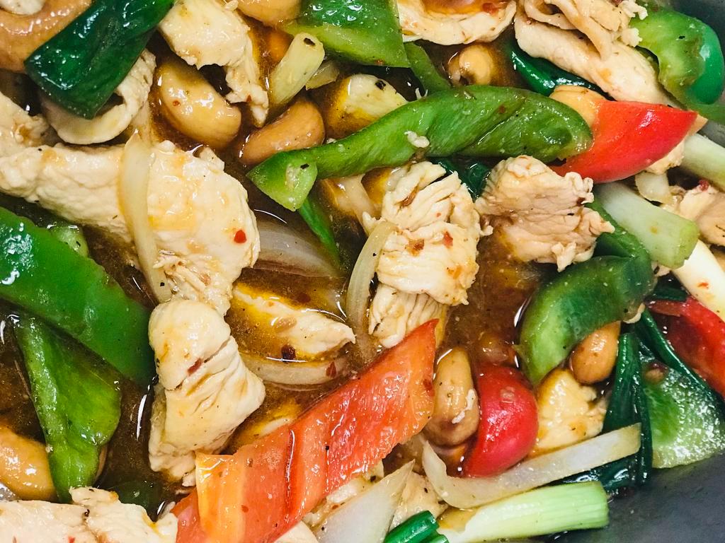 14. Cashew Chicken · Chicken breast stir fried with bell peppers, onions and cashews. Served with steamed rice.