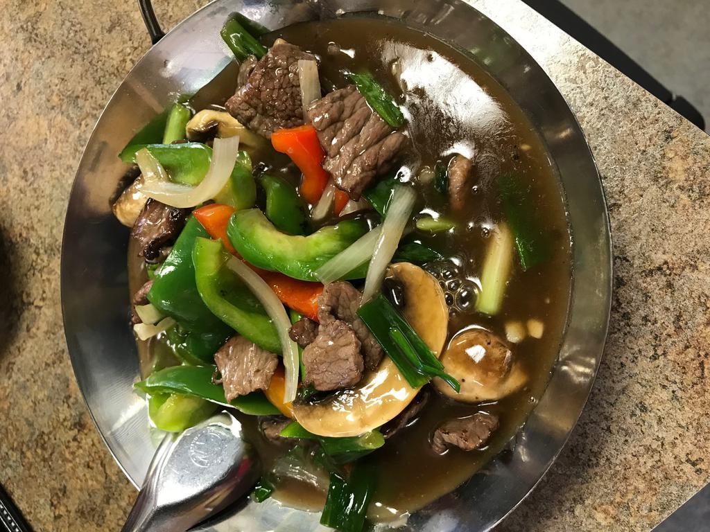 15. Oyster Beef · Stir fried beef in oyster sauce with mushrooms, bell peppers and onions. Served with steamed rice