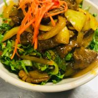 23. Kapoon · Stir fried curry beef served in rice noodles with fresh carrots, lettuce, bean sprouts and c...