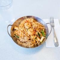 24. Phad Thai · Stir fried rice noodles with shrimp, chicken, tofu, crushed peanuts, bean sprouts, green oni...