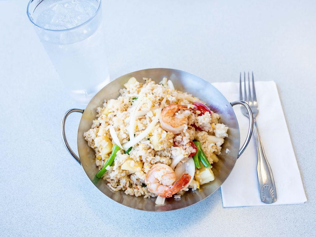 28. Pineapple Fried Rice · Chicken and shrimp with cashew, tomatoes, onions and pineapple.