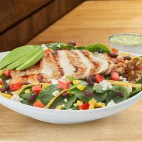 Southwest Kale · All natural chicken breast , baby kale, avocado, black beans, corn,tomatoes, cilantro, torti...