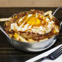 Hold My Knots Pulled Pork Fries · Cheese fries topped with pulled pork, applewood smoked bacon, fried egg, topped with BBQ sau...