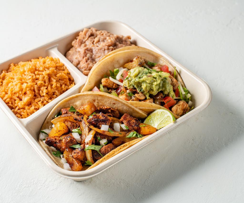 2 Taco Plate · A classic. Two corn or flour tortillas filled with choice of protein, toppings style and salsa. Served with a side of rice and beans. 
