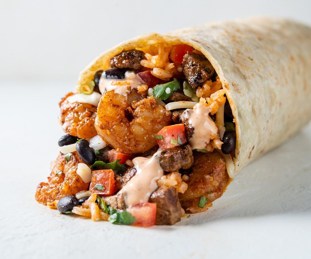 Surf and Turf Burrito · 13” flour tortilla stuffed with marinated, grilled steak, shrimp, beans, rice, choice of toppings and salsa.
