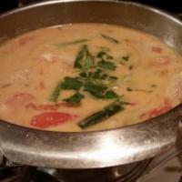16. Shrimp Tom Kha · Coconut soup. Onion, green onion, tomato, cilantro, lime juice and fish sauce mixed with coc...