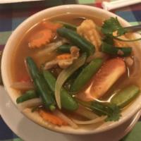 V7. Tom Kha Jay · Variety vegetables or tofu mixed with coconut milk, onion, green onion, tomato, cilantro, li...