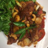 56. Kai Makarm · Crispy chicken stir fried with tamarind sauce, cashew nut, water chestnut, green onion, garl...