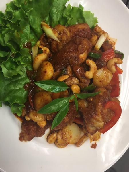 56. Kai Makarm · Crispy chicken stir fried with tamarind sauce, cashew nut, water chestnut, green onion, garlic and red bell pepper. Medium spicy.