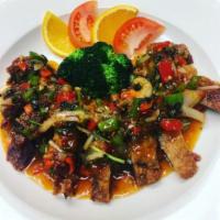 62. Ped Lad Prik · Roasted duck topped with sweet chili sauce, onion, red and green bell pepper and cilantro. M...