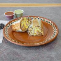 Egg & bacon burrito · Flour tortilla filled with egg & bacon, beans, cheese & grilled to perfection.