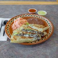 Fajita Quesadilla Plate · Flour tortilla filled with cheese, meat and fresh avocado. Served with rice & beans.