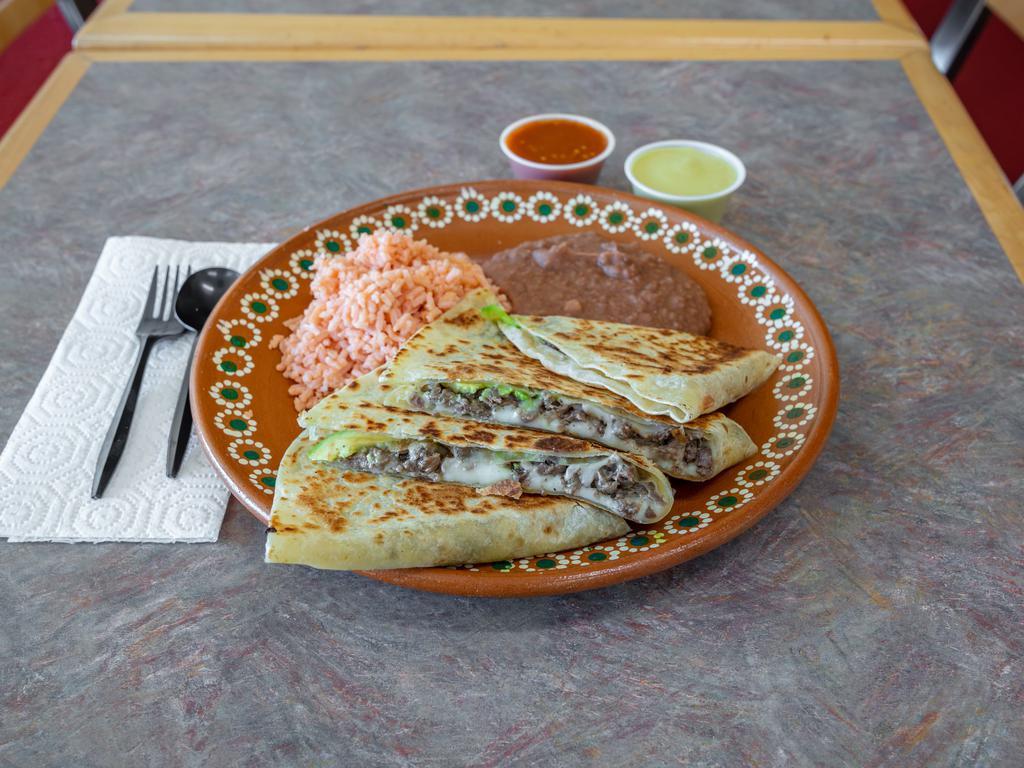Chicken Quesadilla Plate · Flour tortilla filled with cheese, meat and fresh avocado. Served with rice & beans.