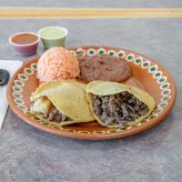 Barbacoa Gordita Plate · 2 corn gorditas filled with cheese & meat served with rice & beans.