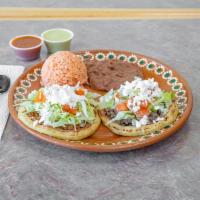 Pastor Sope Plate · 2 sopes (corn) with beans, meat, lettuce, queso fresco, tomatoes & sour cream. Served with r...