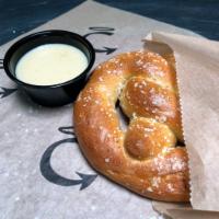 Brewpub Pretzel  · House made pretzel with spent grains from our Brewery Served with IPA Cheddar Sauce