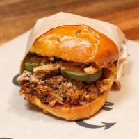 Spicy BBQ Pulled Pork Sandwich Combo · Topped w/ Crispy Onions & Hand-Cut Pickle Slices