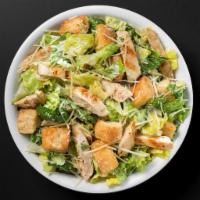 Chicken Caesar Salad · Romaine lettuce, chicken, and croutons tossed in our homemade dressing. Topped with Parmesan...