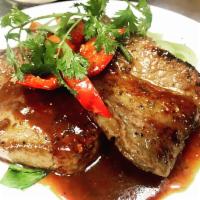 Grilled Tenderloin Beef · Red wine sauce, garlic, mushrooms, snow peas, spicy sauce, bok choy, red peppers, and jasmin...