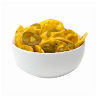 Nachos · Our melted cheese has zero trans-fat and crunchy tortillas chips with sliced jalapenos upon ...