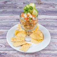 Ceviche · Shrimp ceviche cooked in lime juice. Served with pico de gallo, avocado slices and crackers.