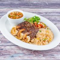Steak and Shrimp · 8 oz. skirt steak and 3 grilled shrimp. Served with rice, beans, guacamole and pico de gallo.